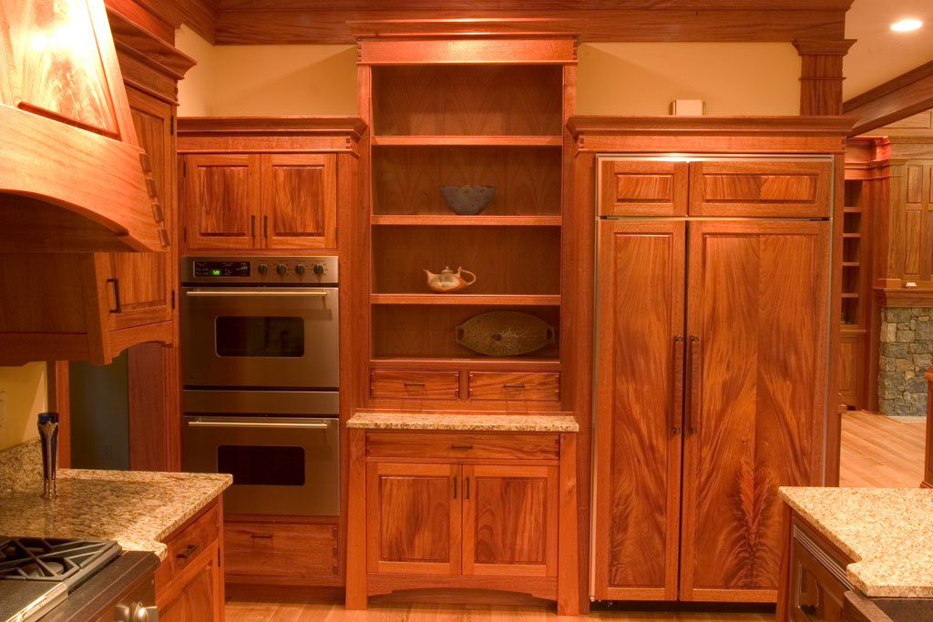 The final wall is the oven cabinet, built in refrigerator and a display cabinet. Continued use of bookmatched sets finishes out our Artisan Kitchen.