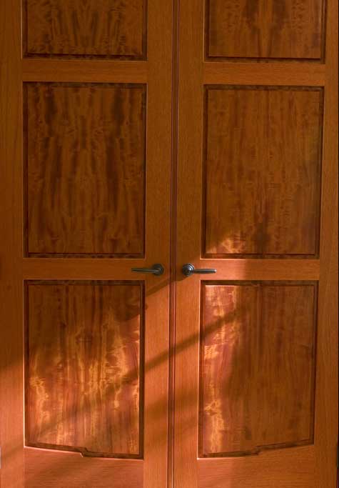 Detail shot of our Greene & Greene inspired beeswing mahogany doors.