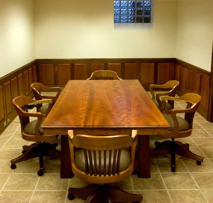 This conference table is 4' x 8' and executed in figured cherry and walnut.  The chairs were commissioned to match.
