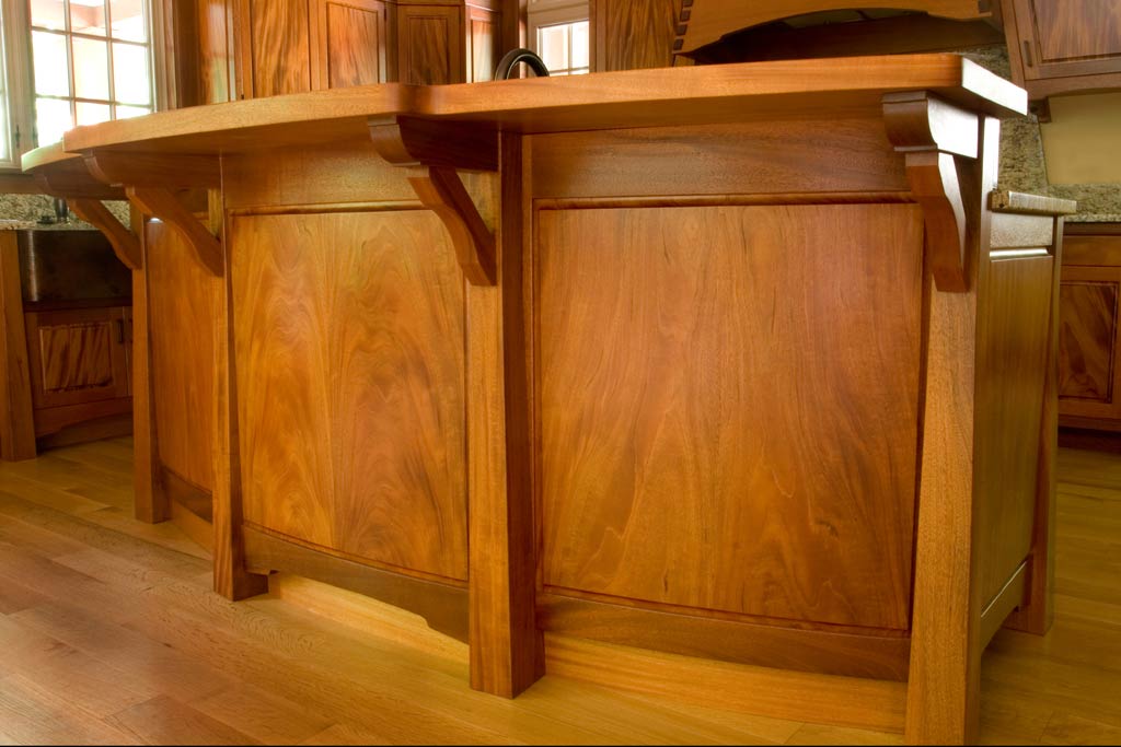 Whenever we have a client that wants kitchen furniture instead of cabinets, we pull out our best materials. This Peruvian mahogany features some beautiful curved panels of bookmatched material.
