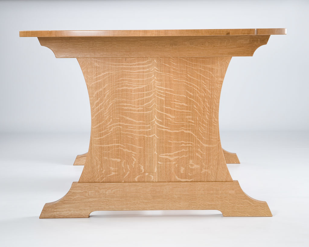 We had a 52" white oak log custom sawed in the quartersawn technique by Guy Bowers, one of the finest sawyers we know. Our commission was to build a dining / work table that celebrated quartersawn white oak. Our design was totally focused on the rare material.